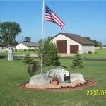 cement landscaping edging with flag