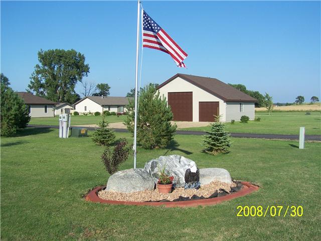 cement landscaping edging with flag
